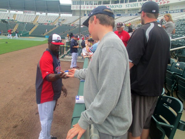 Brandon Boggs, the Twins starting center fielder, takes time out of practice to come sign some autographs