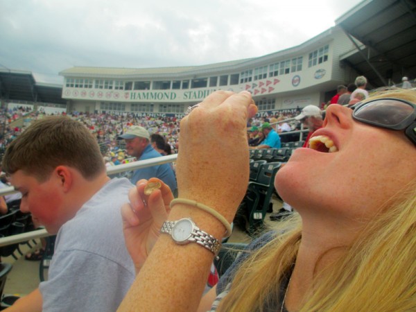 Carina downing the peanuts during the Yankee's game