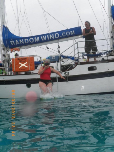 Grandma Holm (Cari's mom) taking a plunge into the Caribbean Sea off The Random Wind.